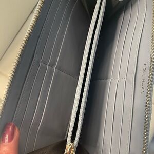 Cole Haan RFID protected, light blue leather zip around wallet, 16 slots.